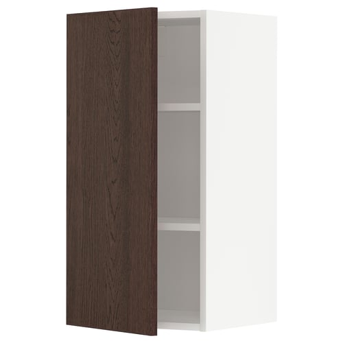 A METOD kitchen unit with a dark brown wooden door and white interior, featuring a single shelf.
