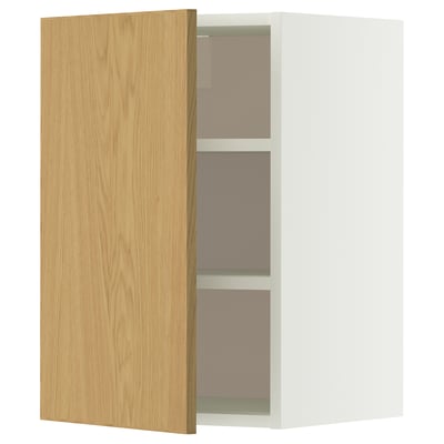 An open white METOD wall cabinet with a light oak door, featuring two shelves inside.