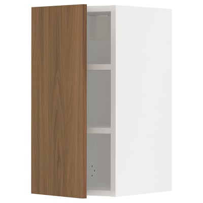 An open METOD kitchen wall cabinet with a tistorp walnut brown door, featuring smooth surfaces and simple design.