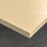 Close-up of light wood table surface, smooth and clean.