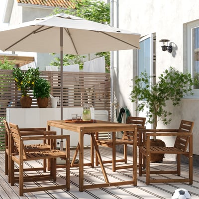 NÄMMARÖ outdoor dining set with table, 4 chairs, umbrella, and drinks on deck.