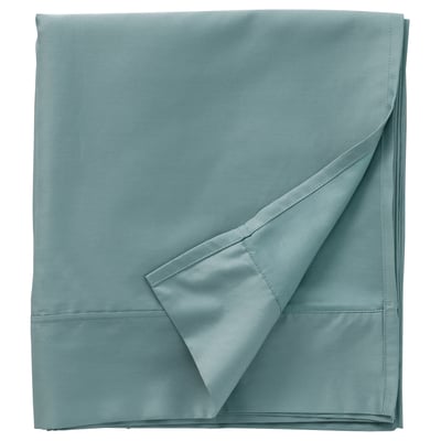 A neatly folded light blue-green NATTJASMIN sheet set, silky smooth with pleated edge design, made from 60% cotton and 40% lyocell.