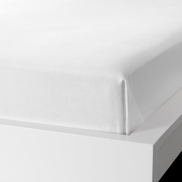 White flannel bedsheet corner, soft and warm.