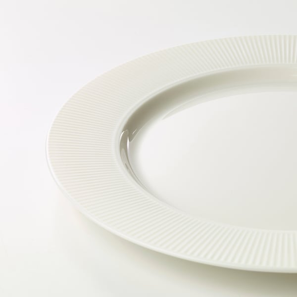 White porcelain plate with textured edge detail, smooth finish, pristine quality.