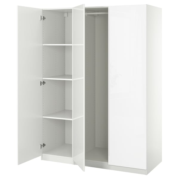 White PAX wardrobe open, showing empty shelves, modern design.