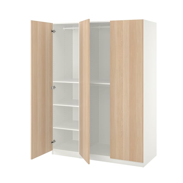 An ikea PAX wardrobe with light oak doors, three shelves, and hanging space.