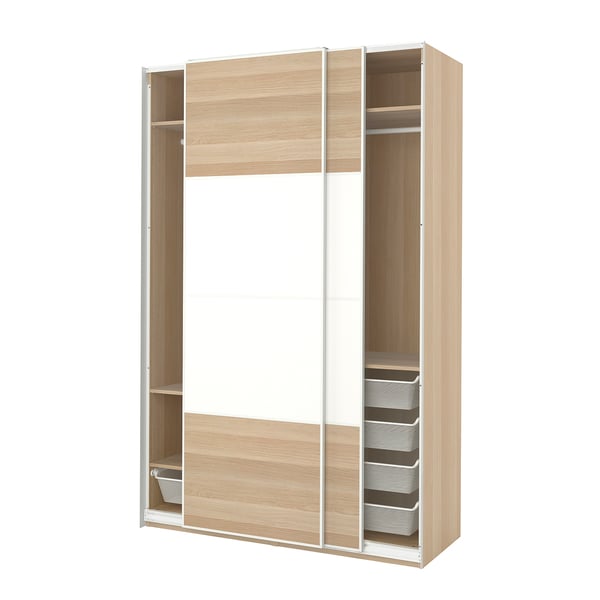 Depicts a light brown PAX wardrobe with sliding doors, featuring a mesh basket and adjustable shelves.