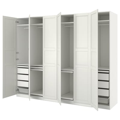This image shows a white ikea PAX wardrobe. It has multiple compartments, drawers, and shelves for storage, featuring a clean, minimalist design.