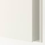 Minimalist white wardrobe with sleek door, reflecting quality and simplicity.