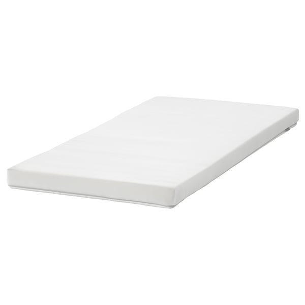 A white, rectangular baby mattress by ikea, named PELLEPLUTT, with a smooth surface and a zippered cover for easy washing.