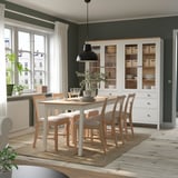 Cozy dining area with beige PINNTORP set, six chairs, and large windows.