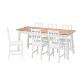 A pine and white wooden dining set called PINNTORP, including a rectangular table and six matching chairs with high backs.