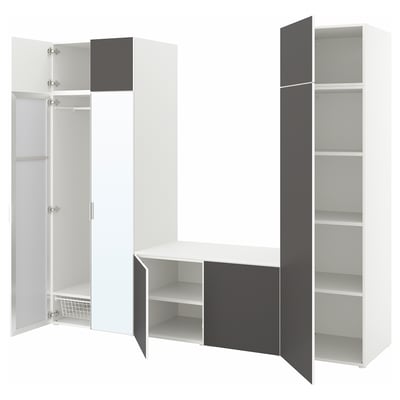 Modern white and grey closet system, featuring open and closed storage with shelves and hanging space.
