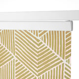 Geometric-patterned rolling curtain. Privacy and light reduction, ideal for windows. Aluminum rail system.