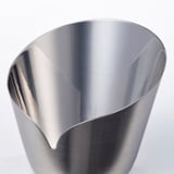 Stainless steel candle holder, sleek and polished inside, matte outside, resembling delicate flower petals.