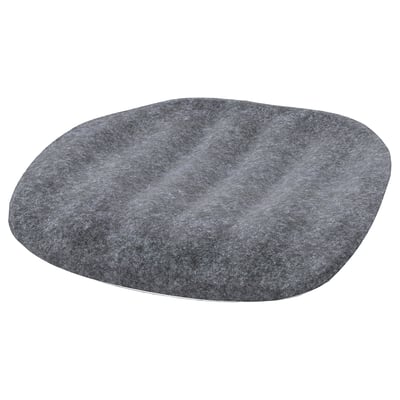A grey circular seat cushion, designed with soft, rounded edges. Made from recycled materials, its intended for a kids desk chair.