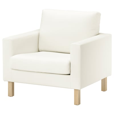 A white SALTSJÖBADEN armchair with light wooden legs, sleek design, and cushioned seating.