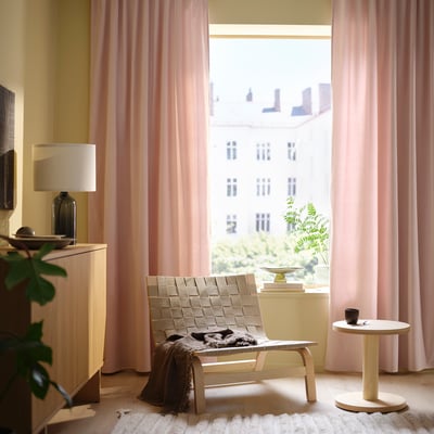 Pink velvet curtains with rod pocket, elegant pleats, and thick fabric for sound dampening and light filtering.