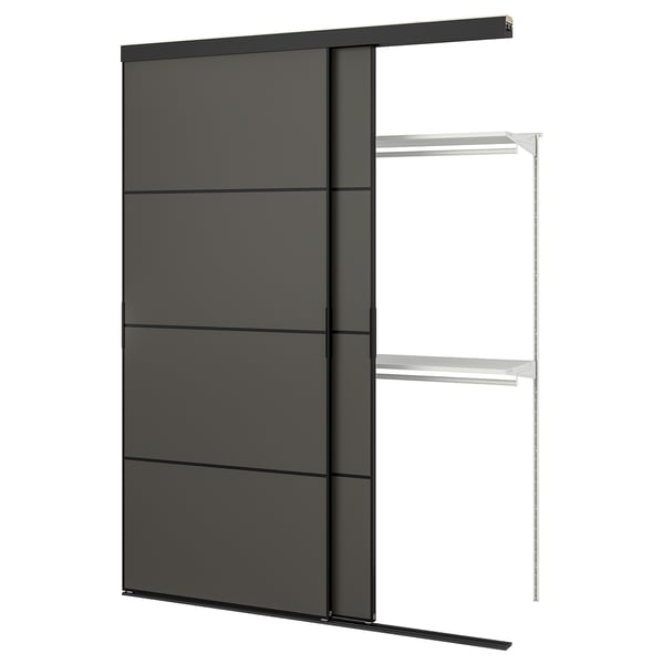 The SKYTTA modern black sliding door with sleek metal frame and dark panels.