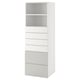 A white SMÅSTAD storage unit with an open shelf at the top and five drawers below, ideal for organizing various items.