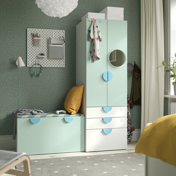 Mint green SMÅSTAD kids storage with wardrobe, round mirror, and deep drawers.