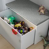 White toy storage bin filled with colorful toys, featuring a gray lid with dotted pattern, ideal for kids room.