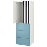 A white and blue ikea SMÅSTAD wardrobe with black and white striped doors. It has a cabinet with an open door, drawers, and adjustable feet.