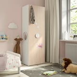 SMÅSTAD wardrobe in kids room. Light wood, tall, slim. Soft-close doors, adjustable feet. Bed, toys, window with curtains.