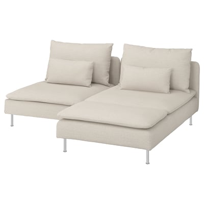 A beige modular sofa, SÖDERHAMN, with a chaise and two large pillows. The sofa has a modern, low-profile design with chrome legs.