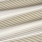 Close-up of soft cotton with fine horizontal stripes, showcasing texture and quality.