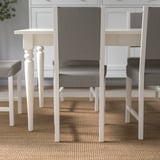 Chairs with removable, washable grey fabric cover and wood fiber padding for comfort and durability.