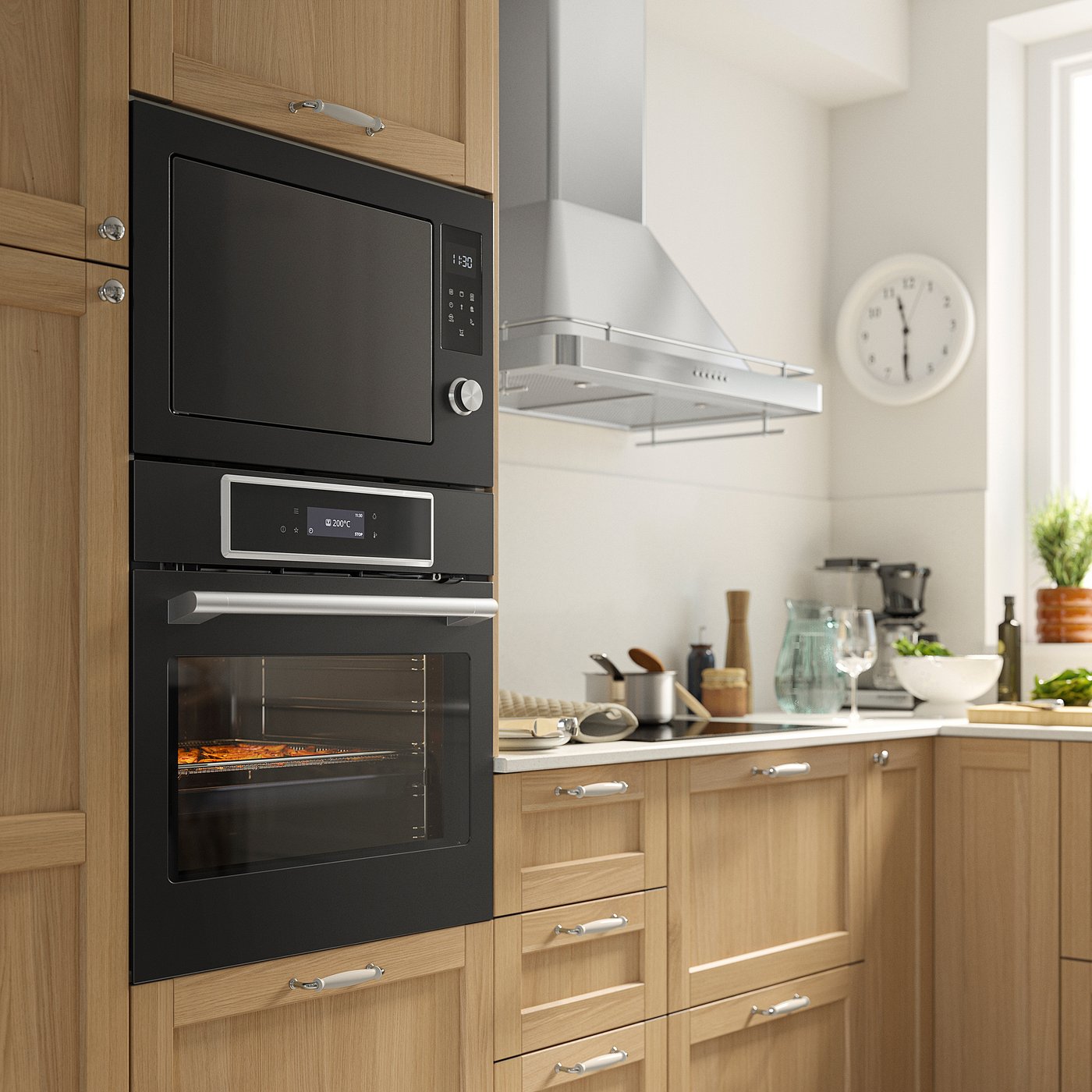 Modern kitchen with black IKEA STENABY oven, built-in microwave, wooden cabinets, and various countertop appliances and utensils.