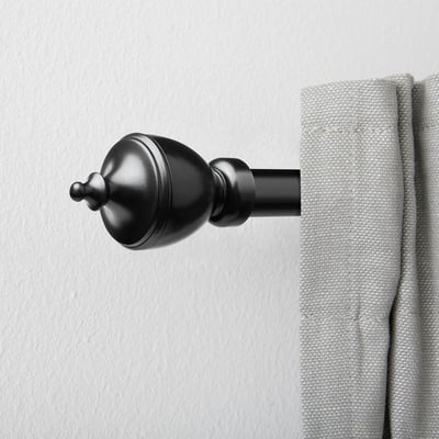 Black, trophy-shaped curtain rod finial, small, nickel-plated end.