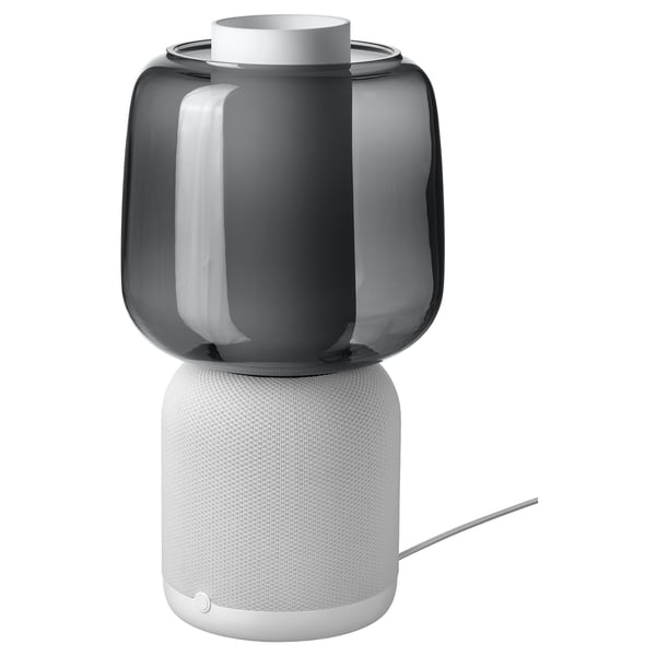 SYMFONISK wifi speaker, black and white, cylindrical shape, fabric and glass, combines lamp and audio.