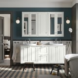 Modern bathroom with large TÄNNFORSEN white cabinets and double basins. Wall-mounted, spacious design with checkered floor and mirrors.