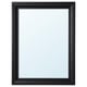 A TOFTBYN mirror. It has a black wooden frame with a classical design. The mirror can be hung vertically or horizontally.