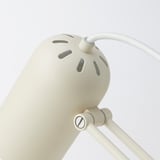 Adjustable white desk lamp with round shade, sturdy steel base, and flexible arm. Excellent build quality for durability.