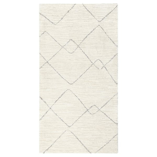 TVERSTED rug. Cream with diamond patterns, rectangular shape. Modern berber-inspired design, soft and stain-resistant.
