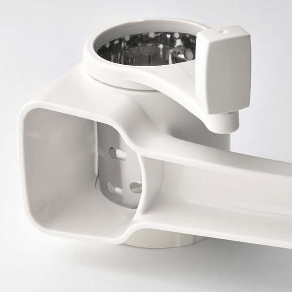 Close-up of UPPFYLLD grater, showcasing its sleek white design and sturdy build, with a focus on the graters intricate details.