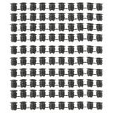 Image multiple rows of black VARIERA cabinet hole covers, displaying their cylindrical shape and ribbed design made of polyethylene plastic.
