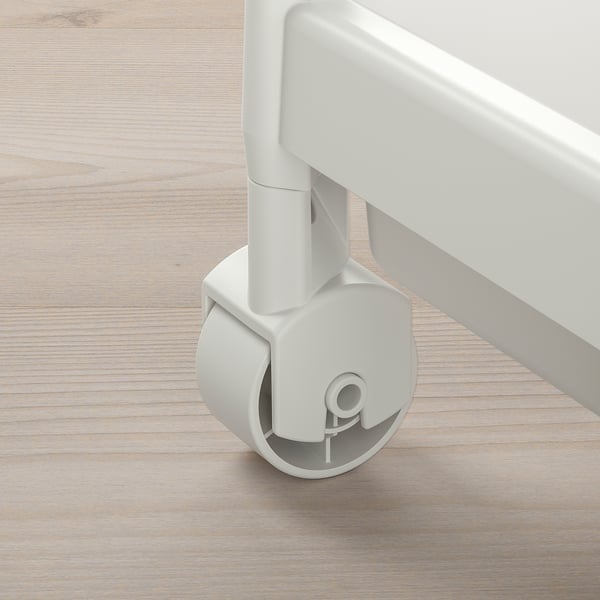 Wheel close-up: smooth, round white caster with central-locking mechanism, attached to sleek metal bar.