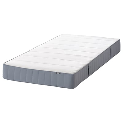 Depicts a white and gray VESTMARKA mattress with a quilted top and bonnell springs, resting on a flat surface.