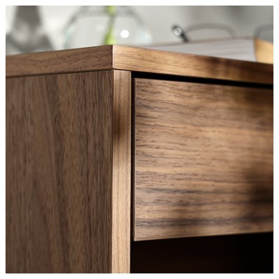 Wooden bedside table detail, featuring walnut veneer finish, soft-close drawer, elegant design.