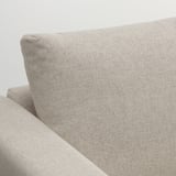 Beige sofa, minimalist design, clean lines, sturdy fabric, polished finish.