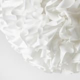 Cloud-like white pendant lamp with soft, recycled material, creating a cozy mood light.