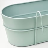 Light blue galvanized steel planter with sturdy handle, suitable for hanging or placing, corrosion-resistant.