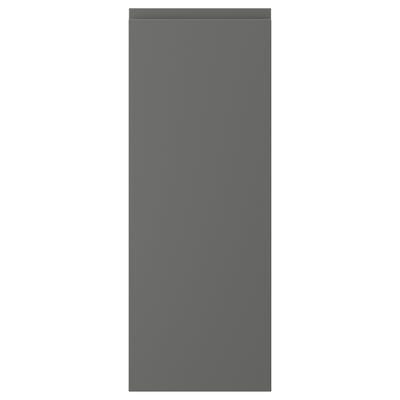 A dark grey VOXTORP cabinet door with a sleek, minimalist design and integrated handles.
