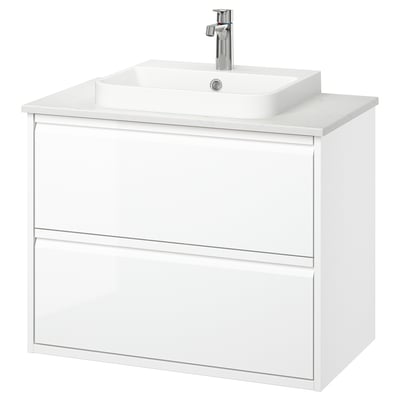 Vaidade de banheiro montada na parede branca, design moderno e elegante com duas gavetas, alças integradas e uma bacia de mármore semi-embutida.