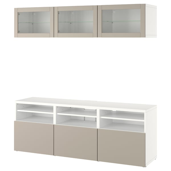 Módulo de arrumação moderno BESTÅ branco e bege com portas de vidro e prateleiras abertas para tv e decoração.