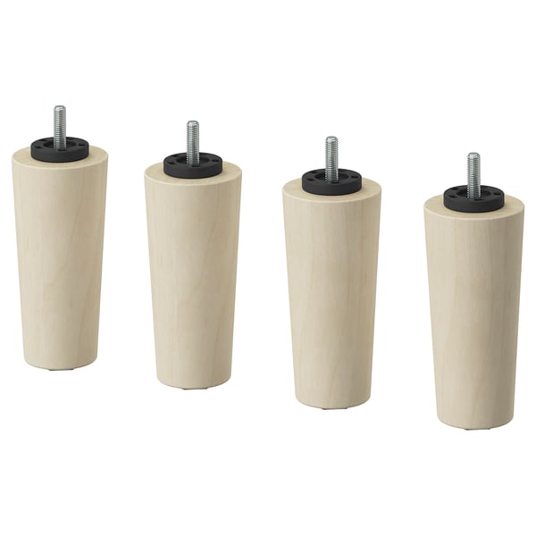 Quatro pernas cilíndricas de madeira castanho claro com acessórios de plástico e metal pretos; Design simples e minimalista.